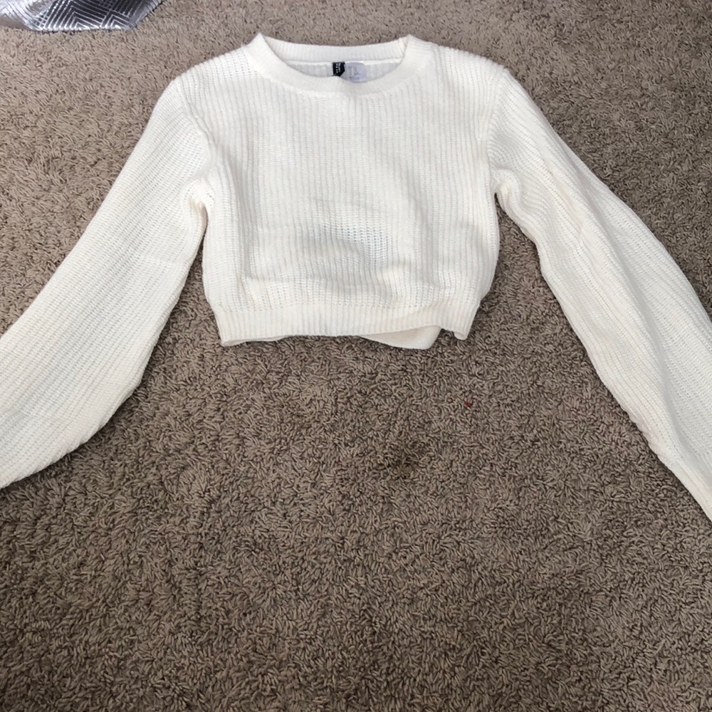 Super adorable knit sweater that is able to be tied in the back!